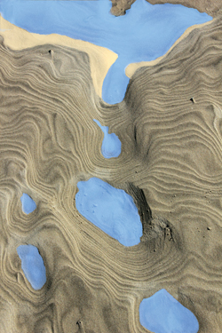 Contoured sand cliff with many lakes